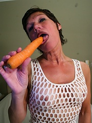 Kinky mature slut getting wet with a carrot
